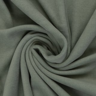 Das Bild zeigt das Baumwollfleece Carlos in altmint. Um die Flauschigkeit darzustellen, wurde der Stoff in sich verdreht dargestellt auf dem Bild.