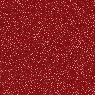 Das Bild zeigt den rostroten Baumwollstoff mit kleinen weissen unregelmaessigen Punkten.