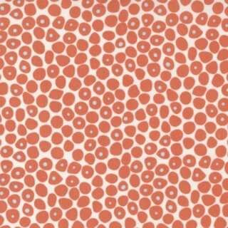 Das Bild zeigt den weissen Baumwollstoff mit unregelmaessig geformten orangefarbenen Punkten.