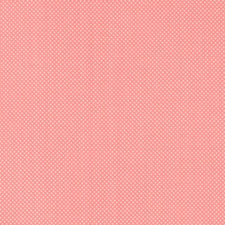 Das Bild zeigt einen lachsfarbenen sehr fein weiss gepunkteten Baumwollstoff.