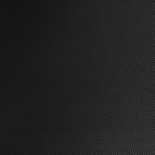 Das Bild zeigt das vegane Leder in schwarz in einer strukturierten oder gepraegten Oberflächenoptik.