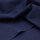 Das Bild zeigt den Heavy Washed Canvasstoff in  indigo night. Es ist ein klarer, leuchtender, dunkler blauton. Der Stoff liegt leicht aufgefaechert auf einem Tisch.